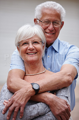 Buy stock photo Senior, portrait and happy couple with hug for embrace, love or support together in retirement. Elderly, man and woman with smile or morning comfort for bonding, commitment or romance in neighborhood