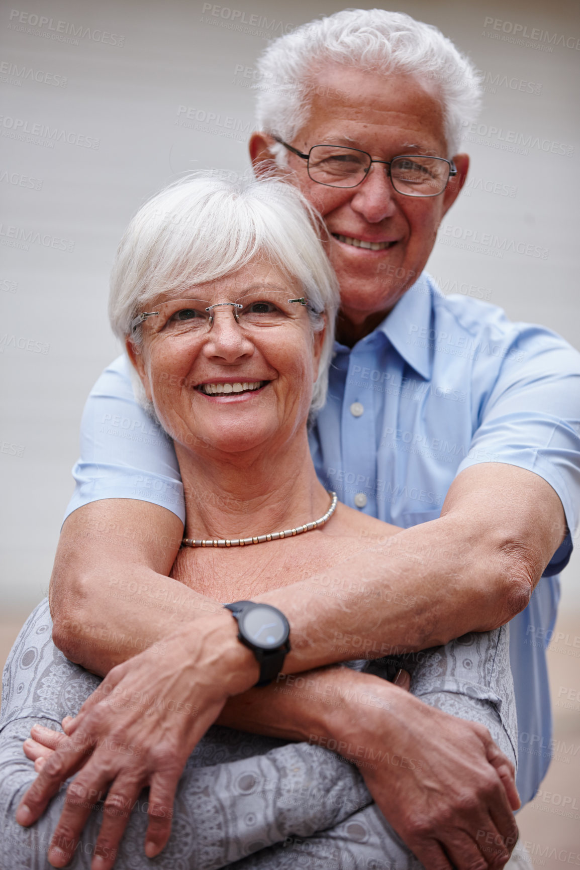 Buy stock photo Senior, portrait and happy couple with hug for embrace, love or support together in retirement. Elderly, man and woman with smile or morning comfort for bonding, commitment or romance in neighborhood