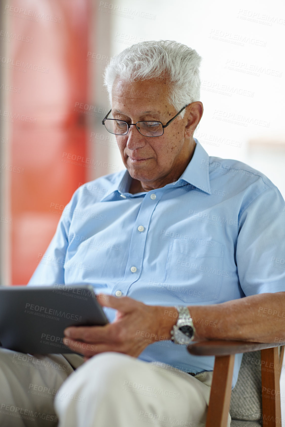 Buy stock photo Senior man, tablet and relax in home for ebook, online banking and memory app. Elderly person, tech and scroll in living room with connectivity, retirement research and booking appointment on website