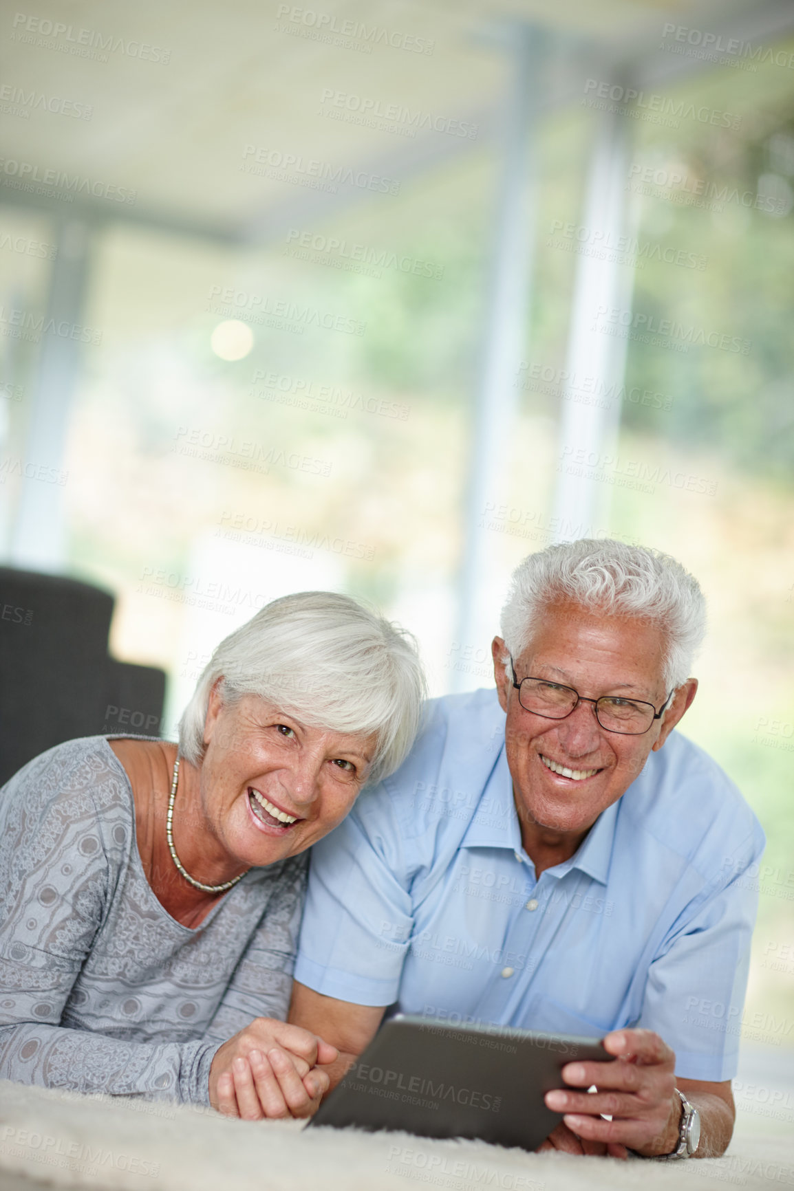 Buy stock photo Senior couple, tablet and portrait in home with ebook, online banking and memory app at space. Elderly people, tech or happy in living room with connectivity, retirement research or ecommerce website