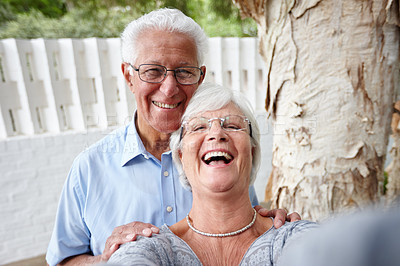 Buy stock photo Shot of a senior couple posing for a selfie