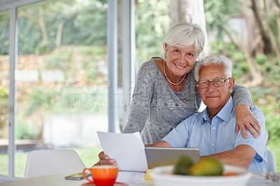 Buy stock photo Man, woman and tablet with documents for portrait with smile for hug, profit or investment growth in home. Elderly people, couple and paperwork with app, review and finance for retirement in Spain