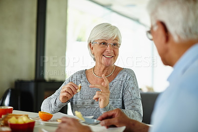 Buy stock photo Shot of a senior couple having breakfast at home