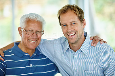 Buy stock photo Portrait of a father and son sitting together