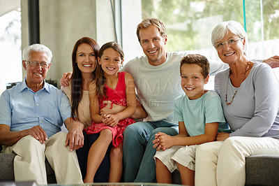 Buy stock photo Portrait of a loving multi-generational family sitting together at home