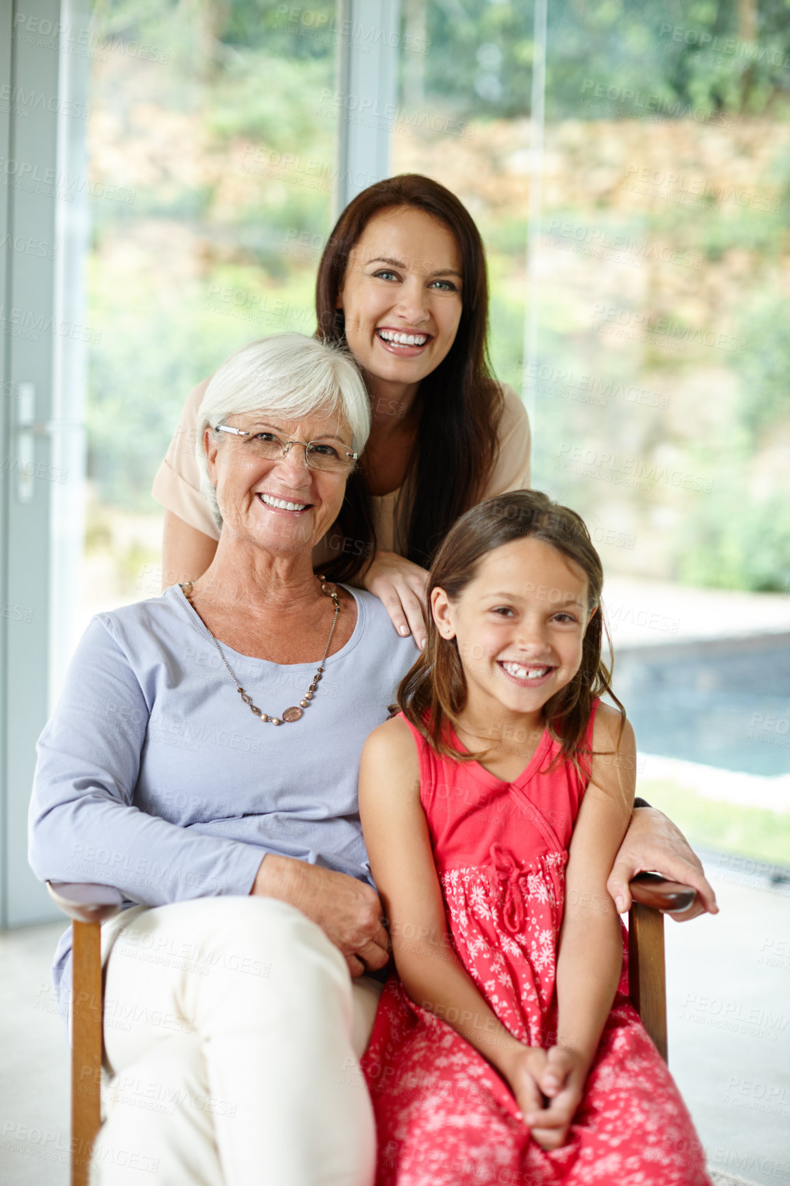 Buy stock photo Home, grandmother and mom with child in portrait, bonding together and embrace relationship on chair. Happy family, grandma and mother with girl for relax, love and connection with trust in house