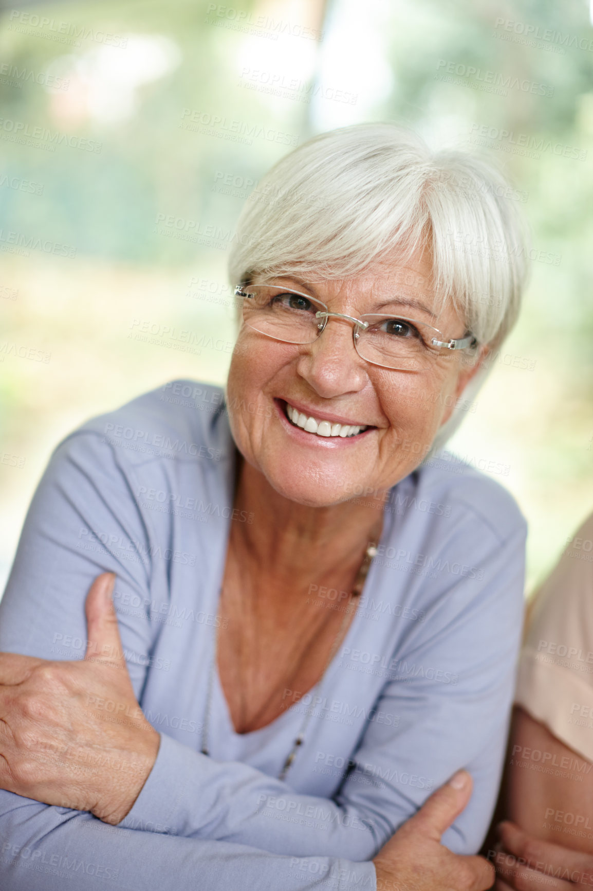 Buy stock photo Portrait of an attractive senior woman relaxing at home