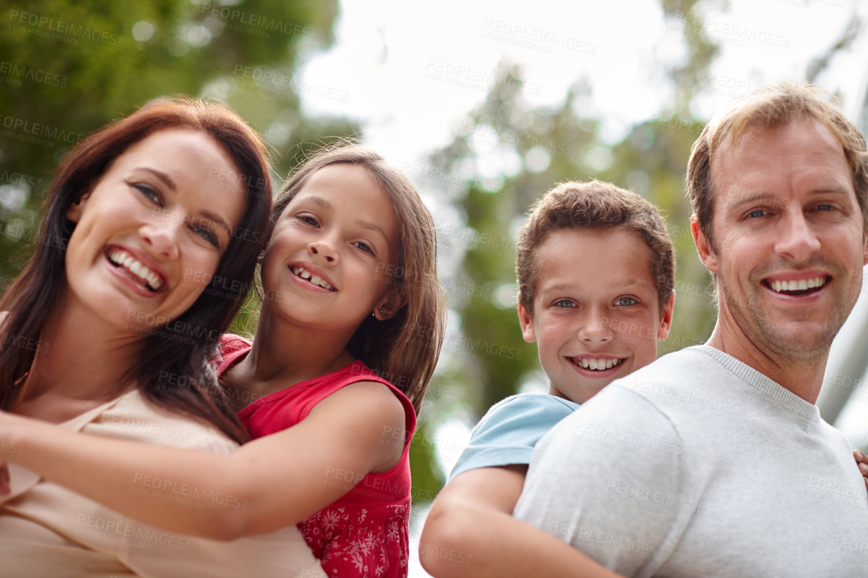 Buy stock photo Family, portrait and piggyback in backyard together for love, bonding and security for connection. Parents, children and support for trust in Switzerland home, kids and outdoor care in relationship