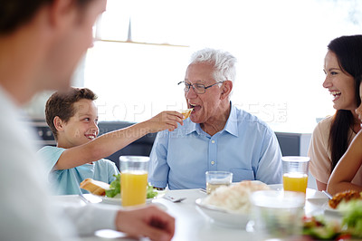 Buy stock photo Family, generation and child at lunch in home for bonding at feast, festive celebration and holiday. Thanksgiving, Christmas party and grandparents with food for dinner, supper and eating together