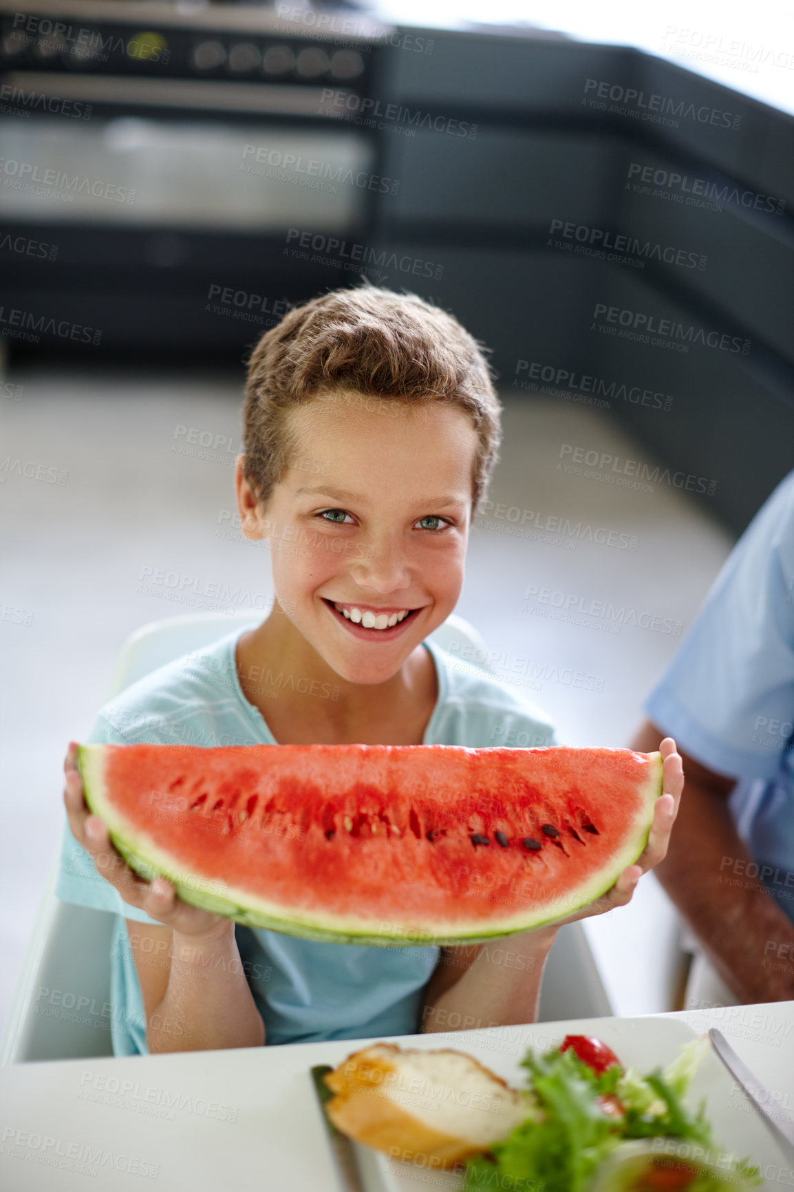 Buy stock photo Boy, child and watermelon for portrait in home with smile, food and excited for wellness in dining room. Kid, fruit and happy for choice, benefits and nutrition with diet at family house in Germany