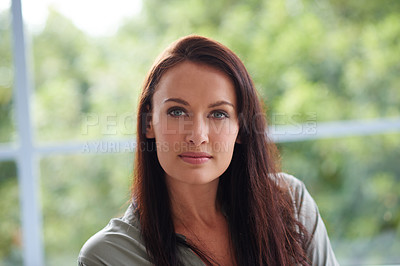 Buy stock photo A young woman relaxing in her living room