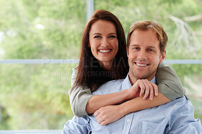 Buy stock photo Cropped portrait of an affectionate young couple at home
