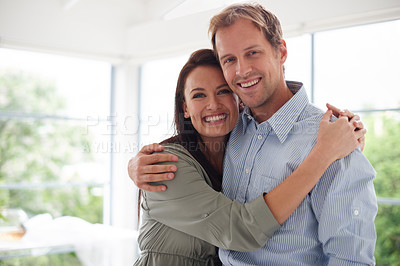 Buy stock photo Cropped shot of an affectionate young couple at home
