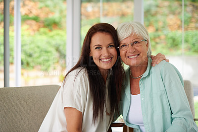 Buy stock photo An adult daughter and her mother spending time together