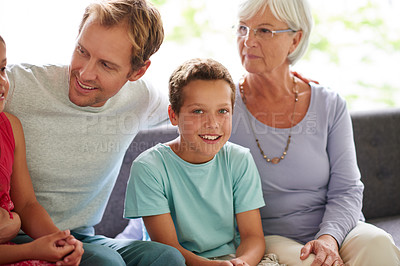 Buy stock photo Family, portrait and child on sofa with smile, relax and happy morning bonding in living room. Father, grandma and boy kids on couch with embrace, support and generations in home together on weekend.