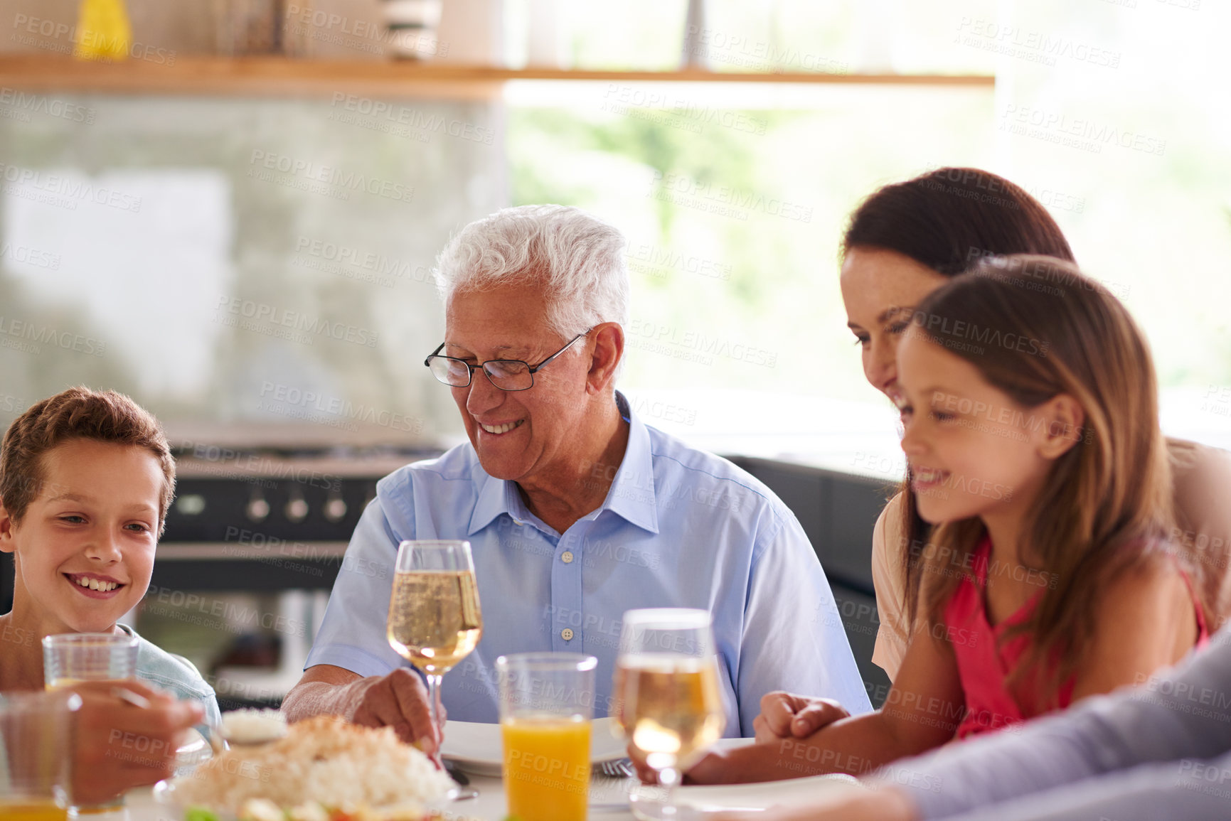 Buy stock photo Cropped shot of a family having lunch together