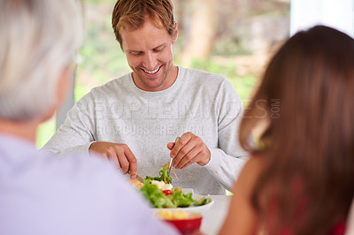 Buy stock photo A family having lunch together