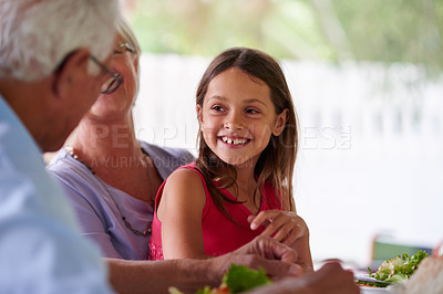 Buy stock photo Shot of a little girl enjoying a day with her grandparents