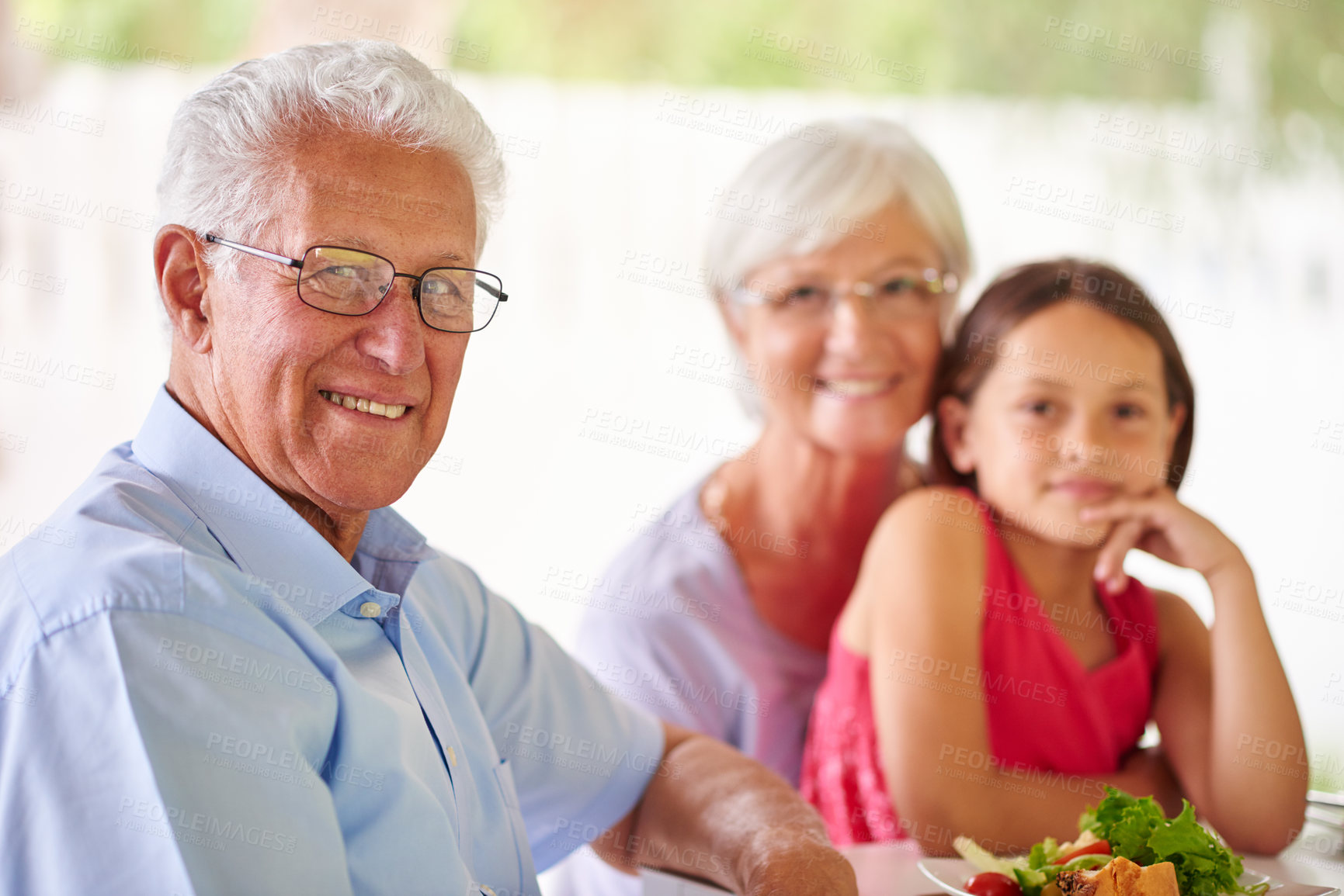 Buy stock photo Portrait, grandparents and girl with food in home, brunch and bonding together as family with meal. Happy people, woman and man with child with wellness, nutrition and vegetables as healthy cuisine