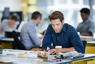 Buy stock photo Tablet, business man and working at desk for research, reading email or check report on app at startup. Technology, creative and interior designer at table for information or planning house project