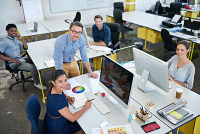 Buy stock photo High angle portrait of a group of designers working at their computers in an office