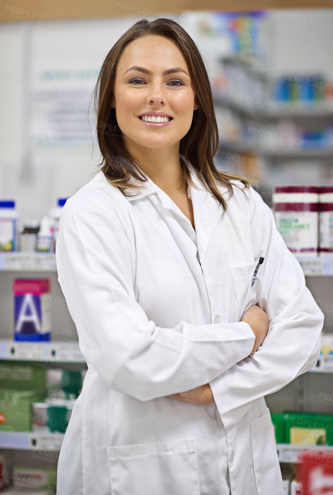 Buy stock photo Portrait of an attractive young pharmacist at work