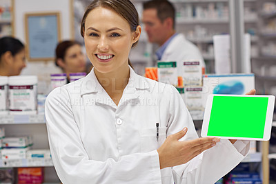 Buy stock photo Portrait of an attractive pharmacist holding up a blank digital tablet display