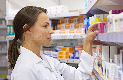 Buy stock photo Pharmacy, stock and box with woman in drugstore for information, supplements and retail medicine. Prescription drugs, pharmacist and inventory with pills, medication boxes and checkout at chemist