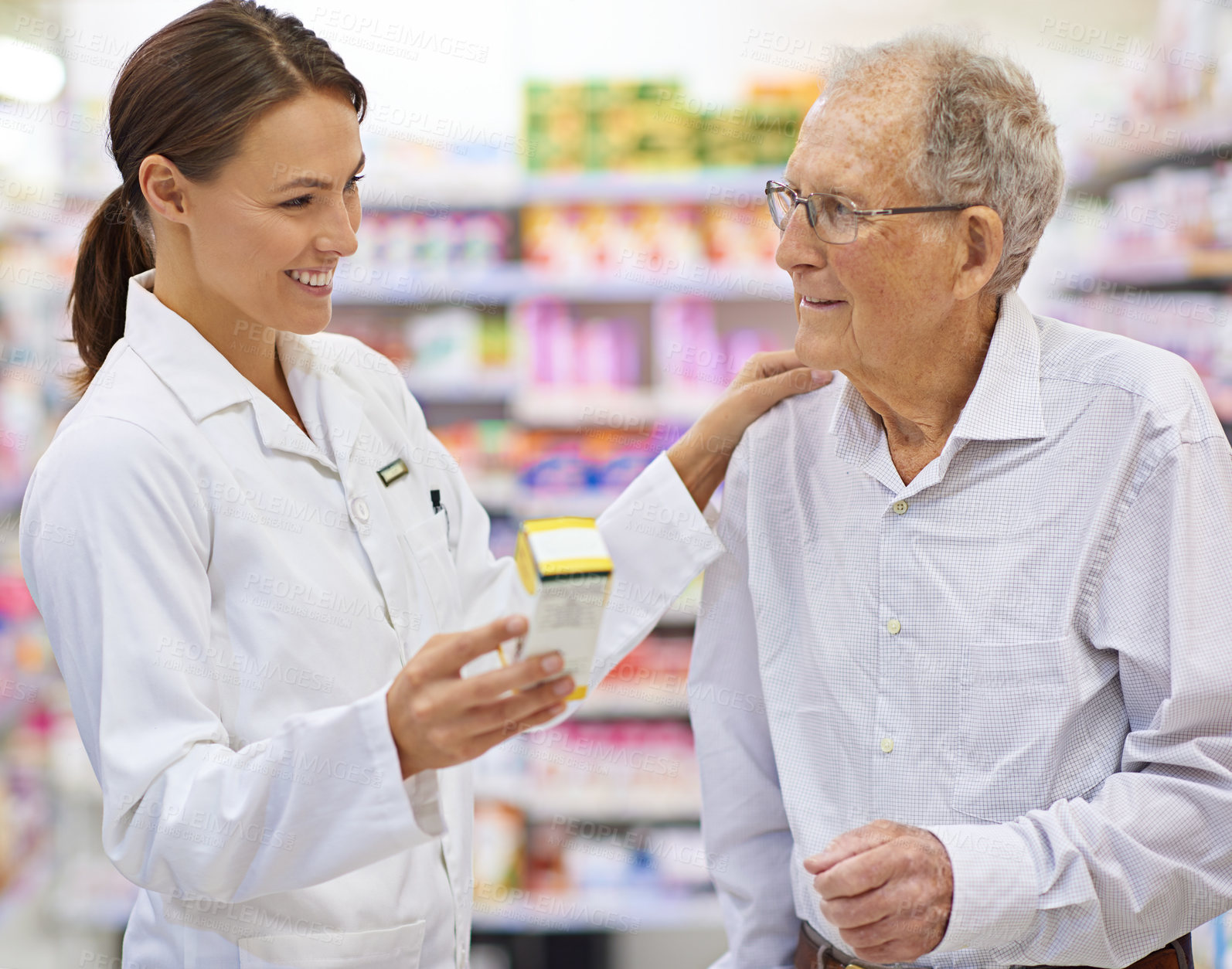 Buy stock photo Medical, pharmacist and senior man with pills for prescription, product information and healthcare advice. Woman, customer and medicine dispensary with instructions, pharmaceutical care and treatment