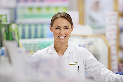 Buy stock photo Portrait of an attractive young pharmacist at work