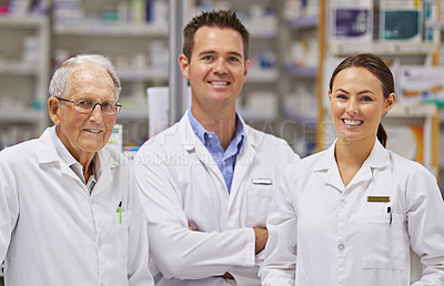 Buy stock photo Portrait of  three pharmacists standing at a counter