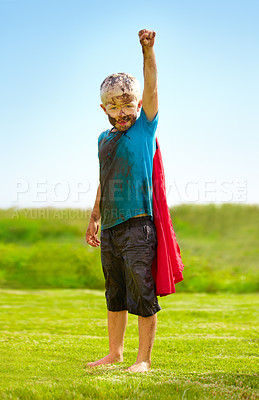 Buy stock photo Dirt, grass and portrait of child with superhero costume, fist and confidence playing outside on lawn, garden and nature. Boy, freedom and fun outdoor for pretend, happiness and excited in youth
