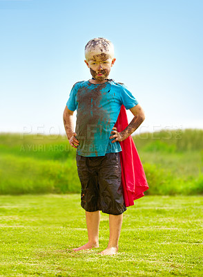 Buy stock photo Outdoor, confident and superhero child at garden on grass, thinking or mockup space on blue sky in summer. Serious boy, kid and hero in costume in dirty clothes, mud and messy for fantasy in Sweden