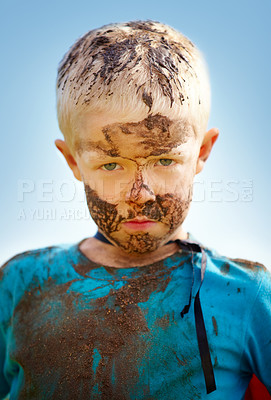 Buy stock photo Boy, child and portrait with mud on face from playing, dirt or naughty in summer weather or water. Kid, person or grime with satisfaction for messy or dirty fun outdoor in sunshine or garden with sky