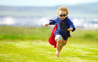 Buy stock photo Young boy, costume and running in park, playing and carefree outdoor with happiness or playful child on grass. Freedom, energy or youth and happy kid in cape or goggles fun on green lawn with mockup