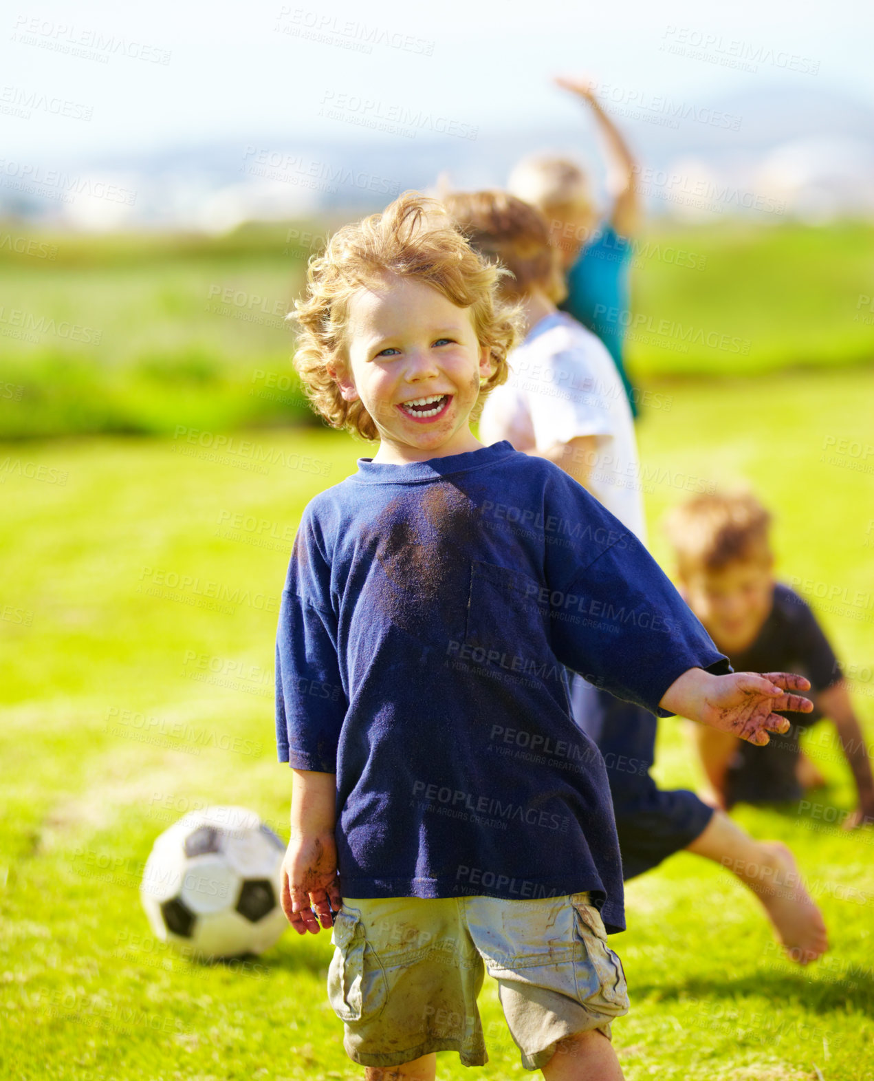 Buy stock photo Dirt, smile and portrait of child for soccer by grass, lawn and outdoor playing with happiness in nature. Boy, freedom or fun in football for activity, comic and excited in youth outside with friends