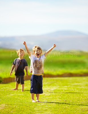 Buy stock photo Dirt, winner and celebration of child for games by grass, lawn and outdoor playing with happiness in nature. Boy, freedom or victory for activity, comic and excited in youth outside with friends