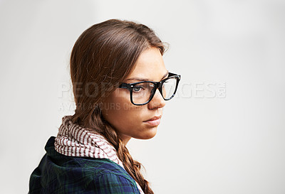 Buy stock photo Thinking, sad and a woman on a studio background for fashion, depression or mental health. Glasses, hipster and a young girl or person looking stylish, trendy and eyewear with thought, plan or vision