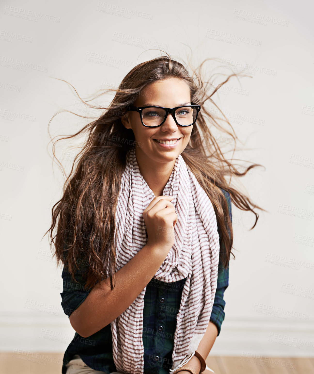 Buy stock photo Smile, woman in glasses and wind in hair for fashion in house, home and apartment wall. Face, eyewear and happy girl, model and attractive person in style, cool clothes and scarf in Switzerland