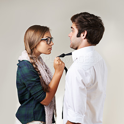 Buy stock photo Angry, fear and couple in a fight on a studio background with conflict, frustrated and toxic. Anger, together and a scared man and woman grabbing for argument, confrontation and a threat in marriage