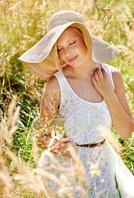 Buy stock photo Summer, hat and smile with woman in field for travel, vacation and holiday. Relax, peace and nature with female person and grass in countryside meadow for calm environment, spring and sunshine