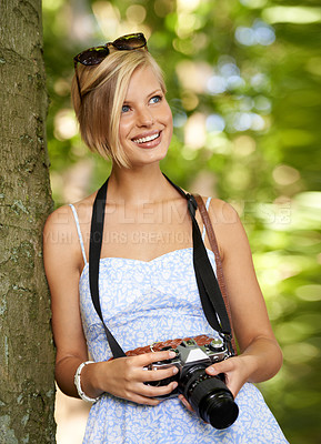 Buy stock photo Smile, nature and photographer with woman in forest for relax, memory and travel photography. Summer, trees and adventure with female person with camera for vacation, holiday or environmental tourism