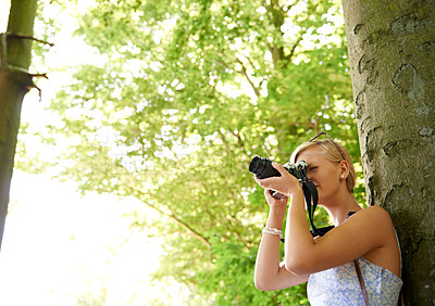 Buy stock photo Photographer, shooting and woman in nature with trees, plants and travel in environment. Forest, park and freelancer filming outdoor ecology on summer holiday, trip or tourist with technology