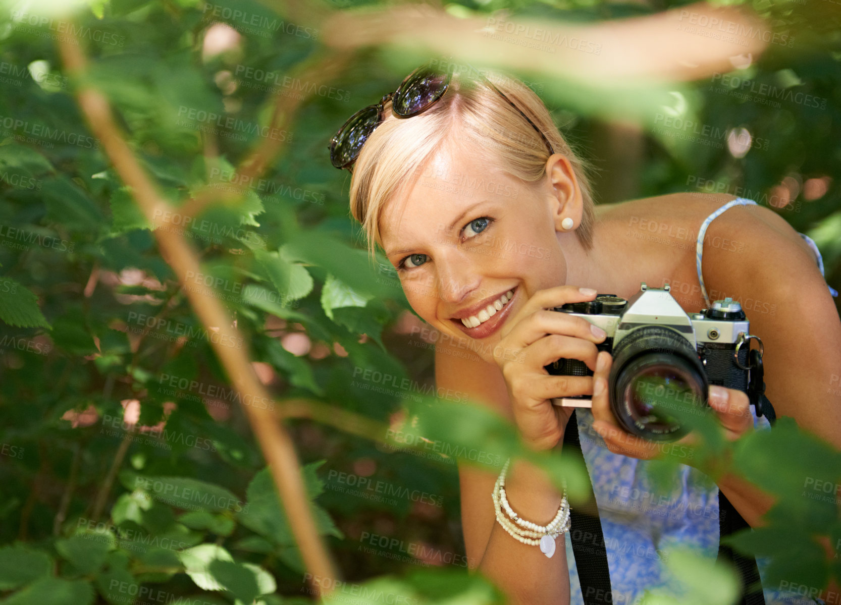 Buy stock photo Nature, portrait and photographer with woman in forest for relax, memory and travel photography. Summer, trees and adventure with person and camera for vacation, holiday and environmental tourism