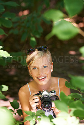 Buy stock photo Portrait, park and photographer with woman in forest for relax, memory and travel photography. Summer, trees and adventure with female person and camera for vacation, holiday or environmental tourism