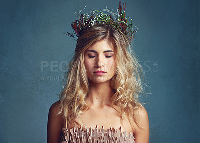 Buy stock photo Beauty, face and fairy girl with flower crown for art and fashion with studio backdrop. Calm, female model and portrait with leaf and plants in her hair for natural style and spring aesthetic 
