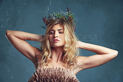 Buy stock photo Nature, makeup and creative woman with flowers in crown in hair and glow on skin in studio. Beauty, magic and inspiration from environment in cosmetics or model with floral style in fantasy cosplay