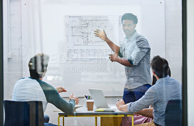 Buy stock photo Cropped shot of a group of architects discussing plans