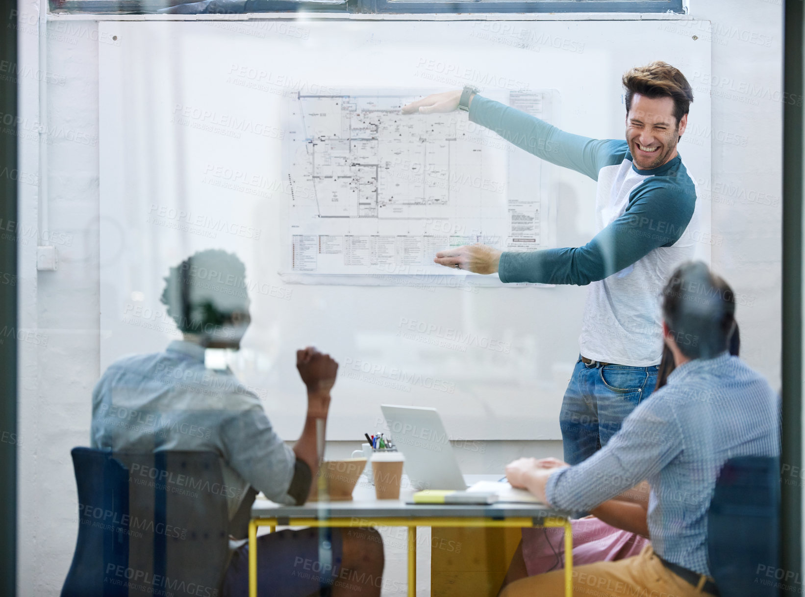 Buy stock photo Cropped shot of a group of architects discussing plans