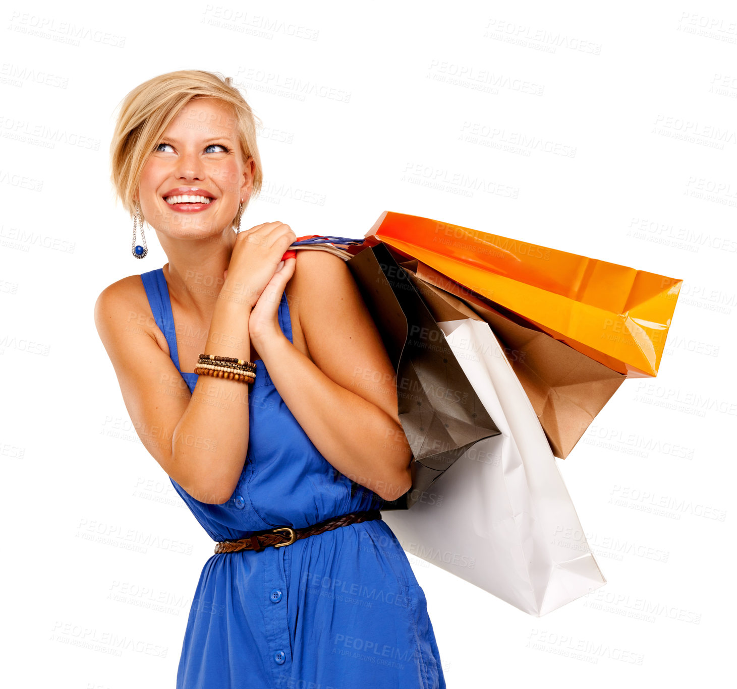 Buy stock photo An attractive young woman holding a bunch of shopping bags